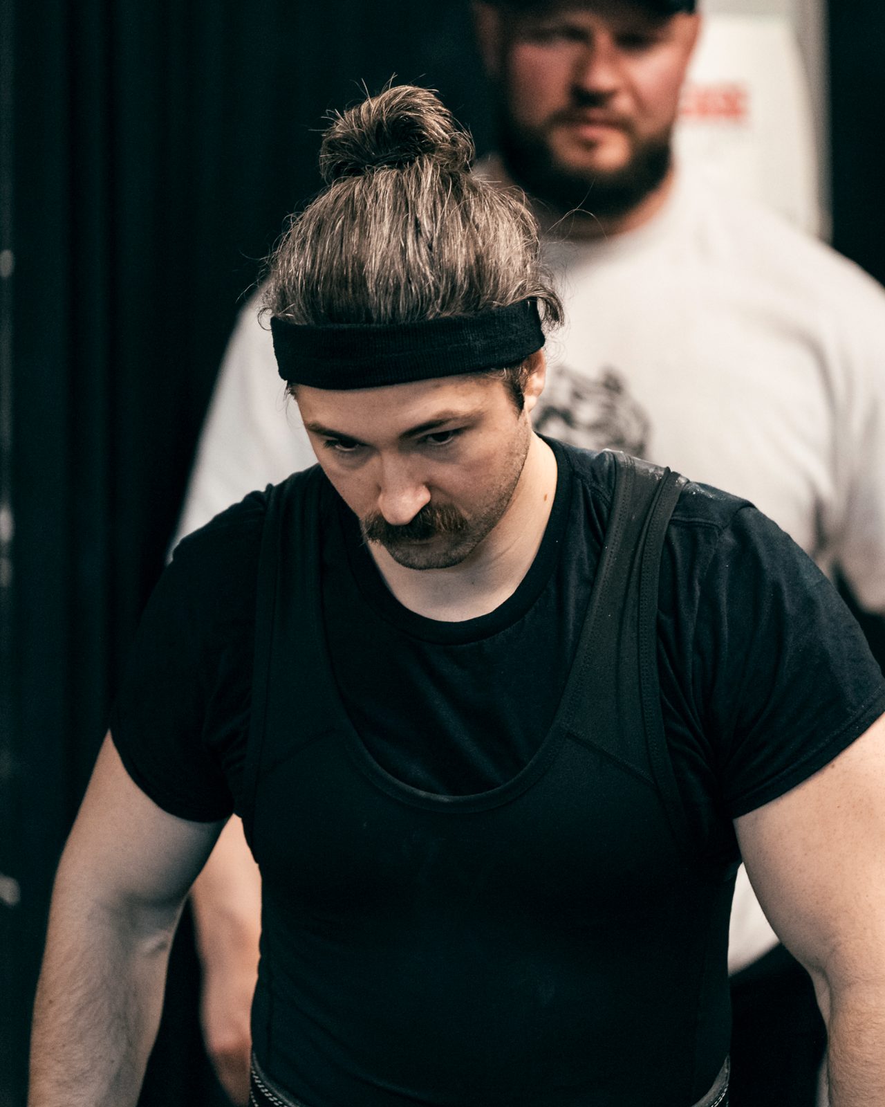 Tanner walking out backstage at a powerlifting meet