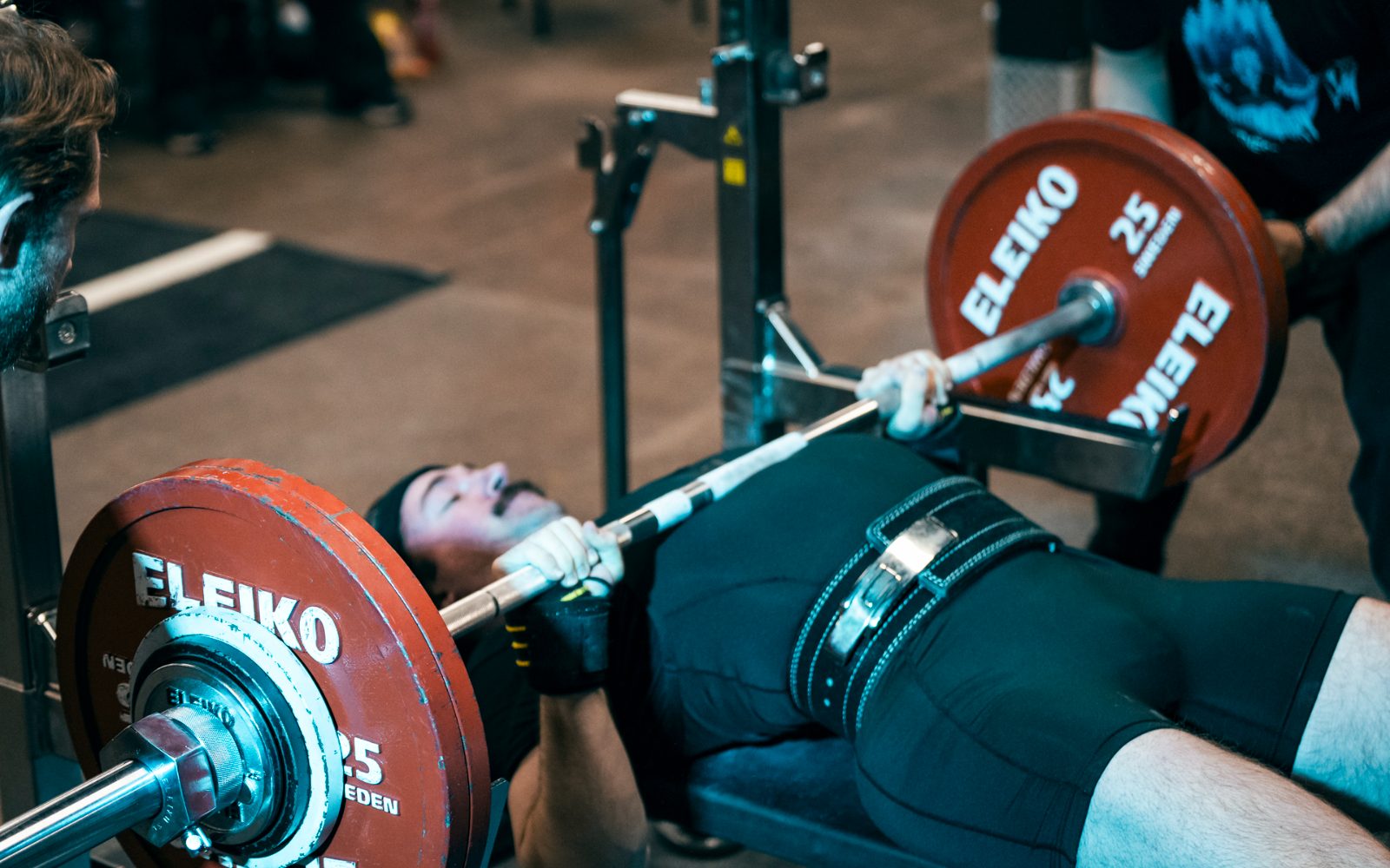 Tanner bench pressing at a powerlifting meet